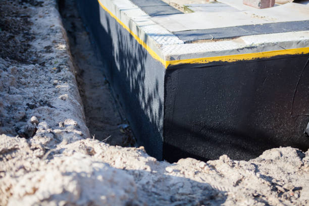 Professional Exterior Waterproofing technician working in Sand Lake, MI